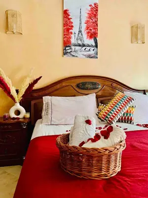 a bed with a basket with stuffed animals on it at Top Location Apartment City Center 1min Away From Tram Station in Casablanca