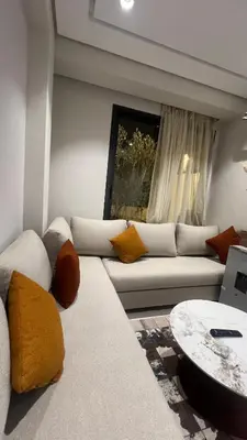 a living room with a couch and a table at home garden in Casablanca