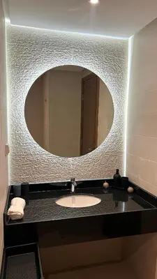 a bathroom with a sink with a large mirror at N28 3 Bedrooms & Private Gym just walking to Stade Moulay Abdellah in Rabat