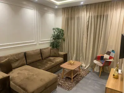 a living room with a couch and a table at Downtown delight studio in Casablanca