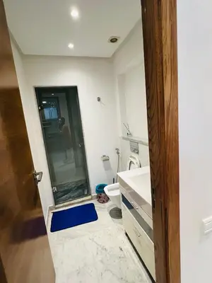 a bathroom with a toilet and a glass shower at Ataraxia in Casablanca