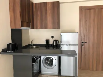 a kitchen with a sink and a washing machine at L'oasis - by Mi-haven in Casablanca