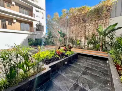 a garden in the side of a building at L'oasis - by Mi-haven in Casablanca