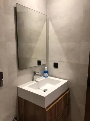 a bathroom with a white sink and a mirror at L'oasis - by Mi-haven in Casablanca