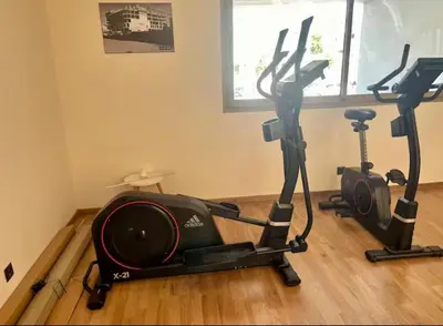 a gym with two exercise bikes in a room at L'oasis - by Mi-haven in Casablanca