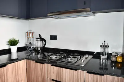 a kitchen with a stove and a counter top at Le Palmier - By Mi-Haven in Casablanca