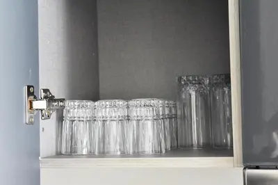 a row of glasses sitting on a shelf at Le Palmier - By Mi-Haven in Casablanca