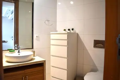 a bathroom with a sink and a mirror at Le Sacré-Coeur - by Mi-Haven in Casablanca
