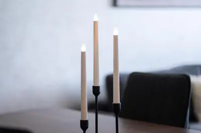 two candles sitting on top of a table at Appartement Premium avec Piscine in Mohammedia