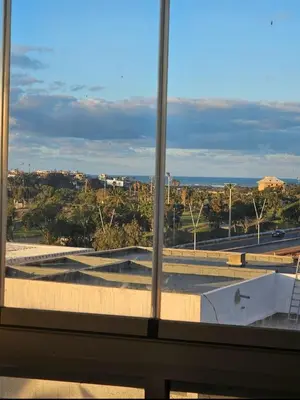 a view of a city from a window at Bouznika rabat in Bouznika