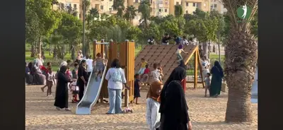 a group of people standing around a playground at Studio de la perle in Casablanca