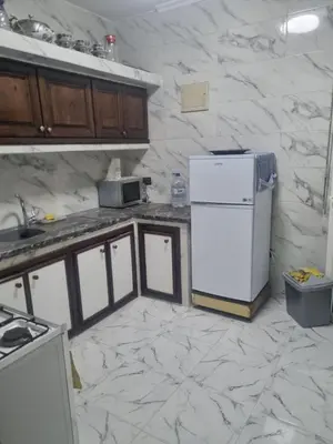 a kitchen with a refrigerator and a counter top at Bayt El Fath in Casablanca