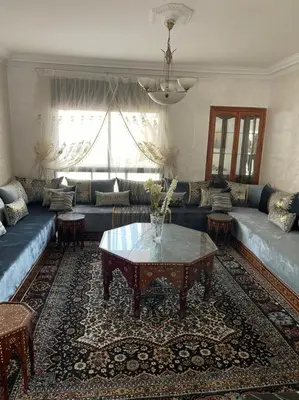 a living room with a couch and a table at Perle de rabat in Rabat
