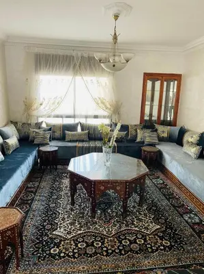 a living room with a couch and a table at Perle de rabat in Rabat