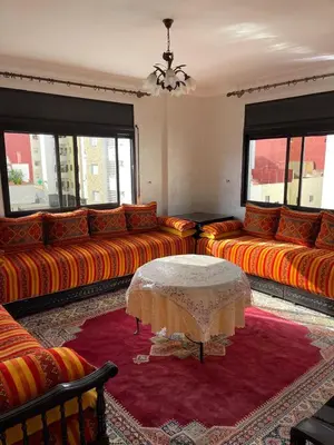 a living room with couches and a table at Perle de rabat in Rabat