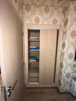 a closet with a door in a room at Studio proche clinique akdital ain sebaa in Casablanca