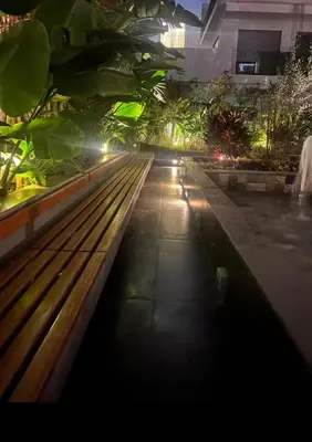 a park bench in a city at night at Badji in Casablanca