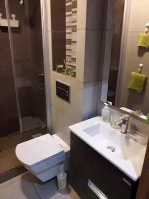 a bathroom with a sink and a toilet and a shower at Appartement sur bd la corniche luxury house with garden close to beach in Casablanca