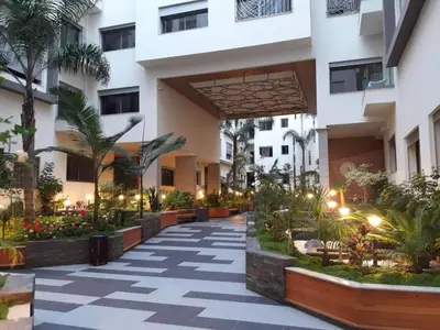 a courtyard of a building with plants and lights at Appartement sur bd la corniche luxury house with garden close to beach in Casablanca