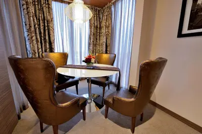 a dining room with a table and chairs at Kenzi Sidi Maarouf in Casablanca
