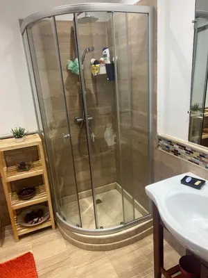 a shower stall in a bathroom with a sink at Évasion océanique skhirat in Skhirat