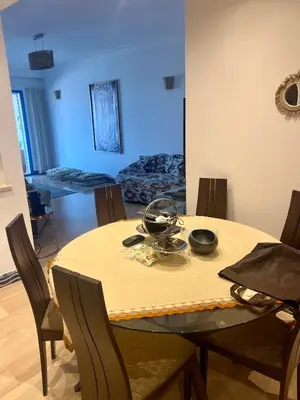 a dining room with a table and chairs at Évasion océanique skhirat in Skhirat