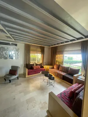a large living room with couches and a table at Maison fantastique à louer à Harhoura près de la plage Votre maison côtière de rêve in Temara