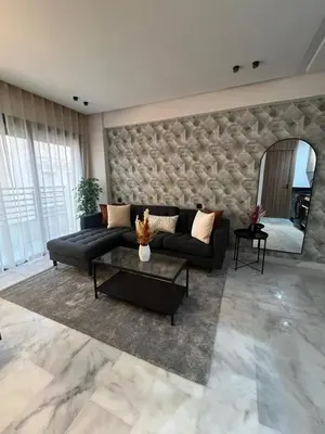 a living room with a couch and a mirror at Élégant Studio Centre Casablanca in Casablanca