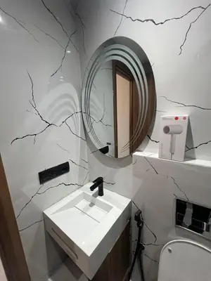 a bathroom with a sink and a mirror at Élégant Studio Centre Casablanca in Casablanca