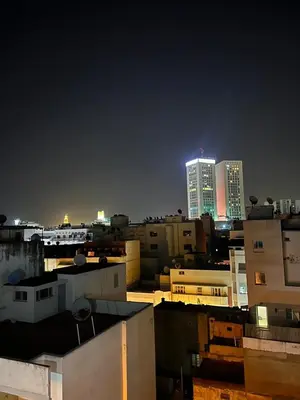 a view of a city at night with tall buildings at Élégant Studio Centre Casablanca in Casablanca
