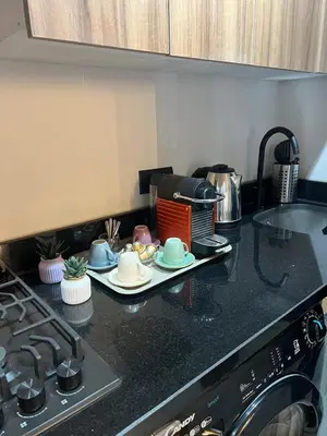 a kitchen with a counter top with dishes and a stove at Élégant Studio Centre Casablanca in Casablanca