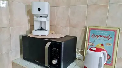 a coffee machine sitting on top of a microwave at 3Bed-Room Appart Agdal City Center in Rabat