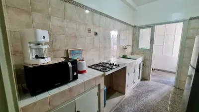a kitchen with a microwave and a counter top with a microwave at 3Bed-Room Appart Agdal City Center in Rabat