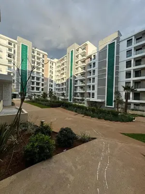 a row of apartment buildings in a parking lot at Minimalist Escape - Between Rabat Agdal Station & Corniche in Rabat