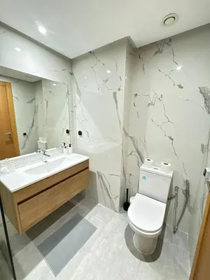 a bathroom with a toilet and a sink at Minimalist Escape - Between Rabat Agdal Station & Corniche in Rabat