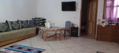 a living room with a couch and a table at CasAmer in Temara