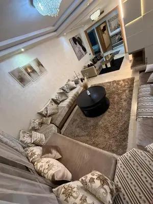 a living room with a couch and a table at Corniche in Casablanca