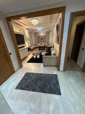 a living room with a couch and a table at Corniche in Casablanca