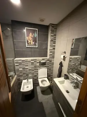 a bathroom with a toilet and a sink at Corniche in Casablanca