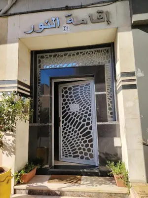 a front door of a building with writing on it at Modern hideaway in Casablanca in Casablanca