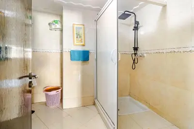 a shower with a glass door in a bathroom at Modern hideaway in Casablanca in Casablanca