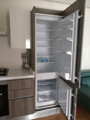an empty refrigerator with its door open in a kitchen at Stunning one bedroom flat at Casablanca Marina 10th floor Sea View in Casablanca