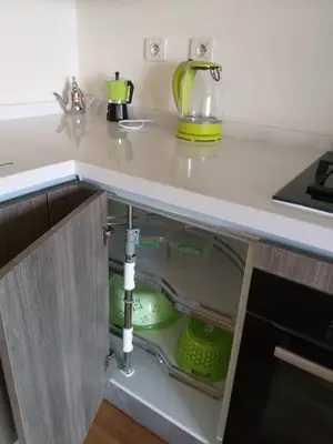a kitchen counter with an open drawer with dishes at Stunning one bedroom flat at Casablanca Marina 10th floor Sea View in Casablanca