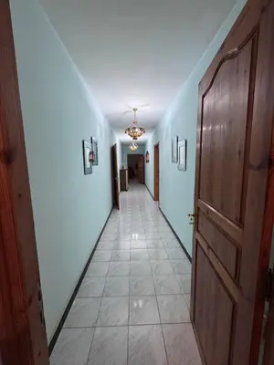 a hallway with a door and a tile floor at Villa élégante à Rabat,harhoura à 4 chambres in Rabat