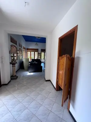 a room with a hallway with a door and a living room at Villa élégante à Rabat,harhoura à 4 chambres in Rabat