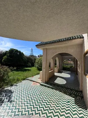 a patio of a house with a stone walkway at Villa élégante à Rabat,harhoura à 4 chambres in Rabat