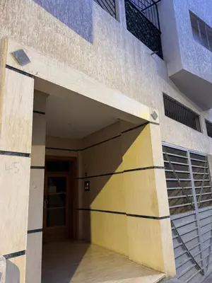 a building with a door and a stair case at Moderne berlin av terrasse in Rabat