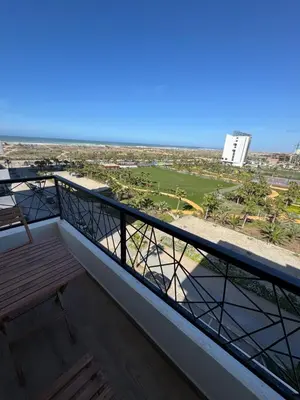 a balcony with a view of the beach at Évasion zen près de Casablanca - Vue imprenable sur le parc et la plage de l'Éco City Zenata in Aïn Harrouda