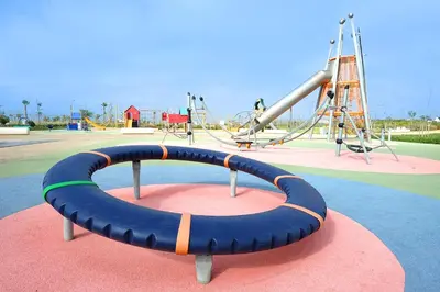 a playground with a slide at Évasion zen près de Casablanca - Vue imprenable sur le parc et la plage de l'Éco City Zenata in Aïn Harrouda