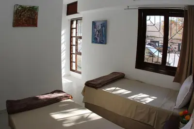 a bedroom with a bed and a window at Apartment Nahda Rabat in Rabat